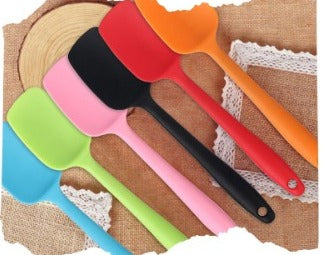 Three pieces in one pack: two premium cotton kitchen cooking gloves for microwave ovens, one silicone spatula spoon for nonstick pans, and a snack basket filled with chips and fried chicken.